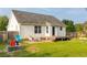 Home features a deck and fenced backyard at 205 Esteban Ct, Mebane, NC 27302