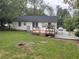 House with a deck and backyard, offering curb appeal at 1737 Hedge St, Burlington, NC 27217
