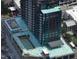 Aerial view of a modern high-rise building under construction in an urban setting at 400 W Main St # 2010, Durham, NC 27701