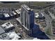 An aerial view of a high-rise building under construction, showcasing its modern design and urban location at 400 W Main St # 2010, Durham, NC 27701