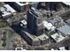 Aerial view of a modern high-rise building under construction, surrounded by urban development at 400 W Main St # 2010, Durham, NC 27701