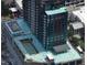 Aerial view of a rooftop pool area under construction on top of a city high-rise building at 400 W Main St # 2402, Durham, NC 27701