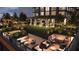 Relaxing rooftop lawn with lounge areas and string lights at 400 W Main St # 2402, Durham, NC 27701