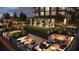 Elegant rooftop terrace with seating areas, fire pits, and string lights at 400 W Main St # 2003, Durham, NC 27701