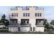 Three-story townhome building with attached garages and rooftop decks at 1313 Garner Rd # 101, Raleigh, NC 27610