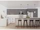 Modern kitchen with gray cabinets, white countertops, and island with seating at 1313 Garner Rd # 101, Raleigh, NC 27610