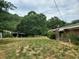 Large yard with shed and brick house at 899 Pittman Ln, Micro, NC 27555
