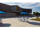 Modern community center with outdoor seating and blue umbrellas at 611 Walnut Hts Dr # 104, Raleigh, NC 27610