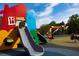 Modern playground with a house and slides at 610 Walnut Hts Dr # 103, Raleigh, NC 27610