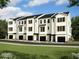 Row of modern townhouses with attached garages at 3702 Nova Star Ln, Raleigh, NC 27612