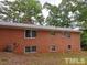 Brick house exterior with multiple windows and AC unit at 1133 Evans Rd, Cary, NC 27513