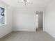Spacious bedroom with window, neutral walls, and walk-in closet at 8917 Grand Highland Way, Wake Forest, NC 27587