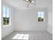Spacious bedroom with neutral decor, carpeted floors, and abundant natural light at 8917 Grand Highland Way, Wake Forest, NC 27587