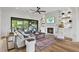 Spacious living room with fireplace, built-ins, and hardwood floors at 8917 Grand Highland Way, Wake Forest, NC 27587