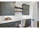 Built-in home office with gray cabinetry and quartz countertops at 8917 Grand Highland Way, Wake Forest, NC 27587