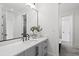 Stylish bathroom with gray vanity, marble countertop, and free-standing tub at 8917 Grand Highland Way, Wake Forest, NC 27587