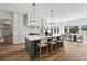 Eat-in kitchen with island, white cabinets, and stainless steel appliances at 8917 Grand Highland Way, Wake Forest, NC 27587