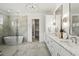Spa-like bathroom featuring a large walk-in shower and freestanding tub at 8917 Grand Highland Way, Wake Forest, NC 27587