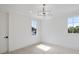 Bright bedroom featuring neutral walls, plush carpeting, and large windows at 8917 Grand Highland Way, Wake Forest, NC 27587