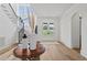 Bright entryway with hardwood floors and staircase at 8917 Grand Highland Way, Wake Forest, NC 27587