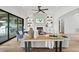 Open living room with hardwood floors, fireplace, and access to backyard at 8917 Grand Highland Way, Wake Forest, NC 27587