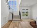 Elegant staircase with black iron railing at 8917 Grand Highland Way, Wake Forest, NC 27587