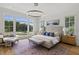 Spacious main bedroom with large windows and sitting area at 8917 Grand Highland Way, Wake Forest, NC 27587