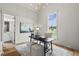 Bright home office with a desk, large window, and hardwood floors at 8917 Grand Highland Way, Wake Forest, NC 27587