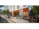 Modern apartment building with street-level retail and outdoor seating at 507 Yancey St # 501, Durham, NC 27701