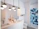 Spa-like bathroom with double vanity and a modern blue tiled shower at 507 Yancey St # 501, Durham, NC 27701