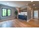 Light and bright bonus room with hardwood floors, built-in bar, and wine cooler at 34 Chestnut Creek Way, Chapel Hill, NC 27516