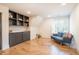 Charming playroom with built-in shelving, hardwood floors, and a comfy couch at 34 Chestnut Creek Way, Chapel Hill, NC 27516