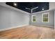 Spacious bedroom with hardwood floors and a blue ceiling at 10 Carnation Rd, Youngsville, NC 27596