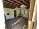 A fixer-upper living room with exposed ceiling beams and hardwood floors at 1610 Angier Ave, Durham, NC 27703