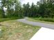Community walking trail winds through a lush green landscape at 167 Edgefield St, Pittsboro, NC 27312