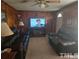 Living room with wood paneling and comfortable seating at 2164 Ray Rd, Spring Lake, NC 28390