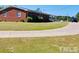 Side view of brick home showcasing landscaping at 2164 Ray Rd, Spring Lake, NC 28390