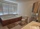 Bathroom with jetted tub and separate shower at 2164 Ray Rd, Spring Lake, NC 28390