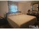 King-size bed in spacious bedroom with ensuite bath at 2164 Ray Rd, Spring Lake, NC 28390