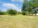 Large grassy yard with mature trees at 2164 Ray Rd, Spring Lake, NC 28390