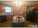 Kitchen with wood cabinets, table, and appliances at 2164 Ray Rd, Spring Lake, NC 28390