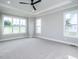 Bright bedroom with carpet flooring and multiple windows at 160 Pondhurst Ln, Fuquay Varina, NC 27526