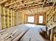 Open floor plan under construction with large windows and exposed wooden beams at 708 Chatham View Rd # 14, Cary, NC 27511