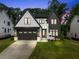 Two-story modern home with dark trim at 5307 Dixon Dr, Raleigh, NC 27609