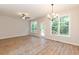 Spacious dining room with hardwood floors and access to deck at 804 N Magnolia Ave, Dunn, NC 28334