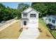 Two-story house with gray siding, white trim, and a two-car garage at 804 N Magnolia Ave, Dunn, NC 28334