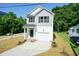 Two-story house with gray siding, white trim, and a two-car garage at 804 N Magnolia Ave, Dunn, NC 28334