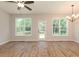 Spacious dining room with hardwood floors and access to deck at 804 N Magnolia Ave, Dunn, NC 28334