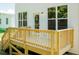 Wooden deck with stairs leading to backyard at 804 N Magnolia Ave, Dunn, NC 28334
