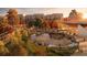 Autumnal view of a community park with pond and walking paths at 714 Chatham View Rd # 17, Cary, NC 27511